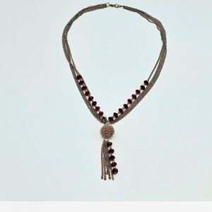 Tassel necklace, costume jewelry. Bag not included.